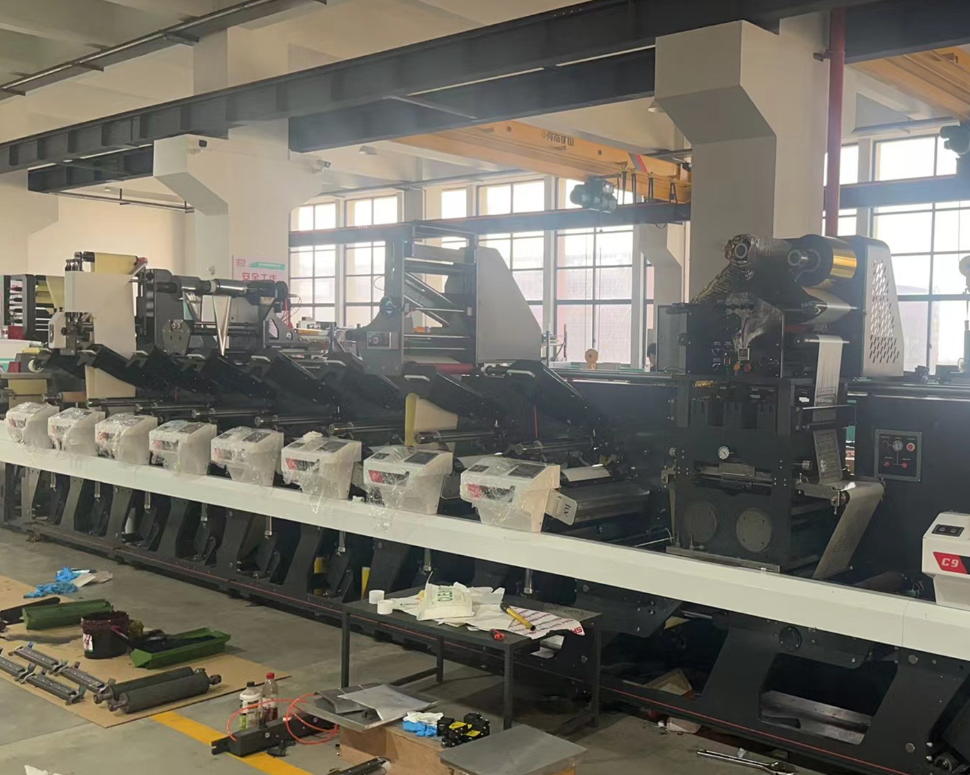 alt="Factory workshop assembly of flexographic label printing machine"