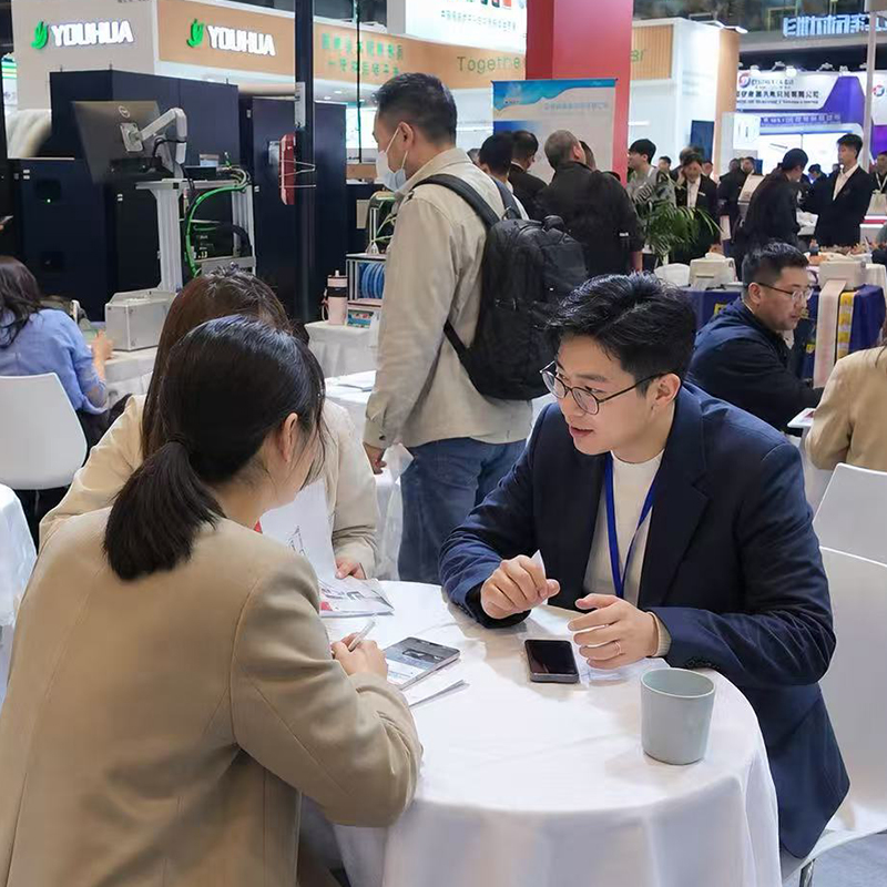 alt="Trade show booth display of narrow web label printing machinery"